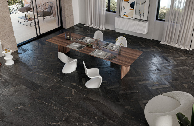 Carrelage effet parquet foncé Ibla de Ceramiche Piemme présent dans une grande salle à manger