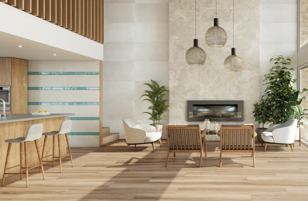 Carrelage effet parquet Bohars de Tau Ceramica présents dans une cuisine ouverte sur un salon