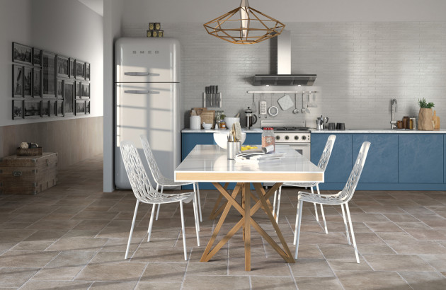 Cuisine et salle à manger au style vintage avec un carrelage au sol de teinte intermédiaire