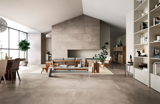 Pièce à vivre équipée de carrelage grand format effet béton ciré
