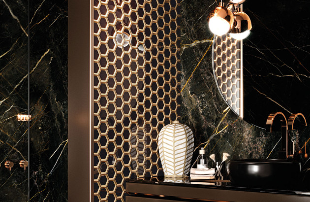 Carrelage noir grand format dans une cuisine contemporaine, finition mate effet béton, illustrant une tendance durable et élégante pour les cuisines en 2026.