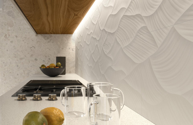 Crédence de cuisine en carrelage relief 3D associée à un plan de travail minéral