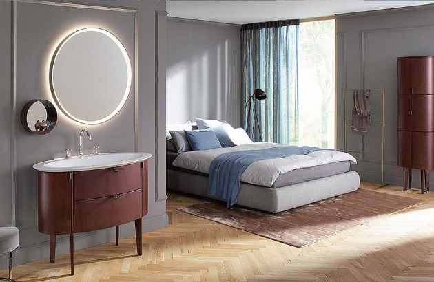 Un miroir arrondie pour accentuer le look vintage dans une suite parentale