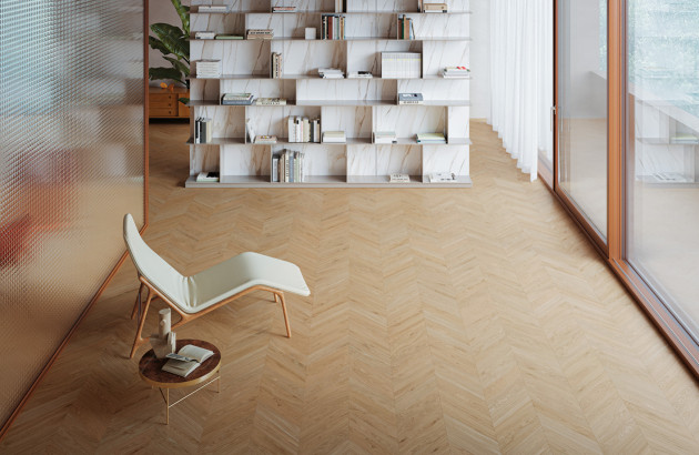 Salle de lecture lumineuse disposant de carrelage imitation parquet posé en chevrons