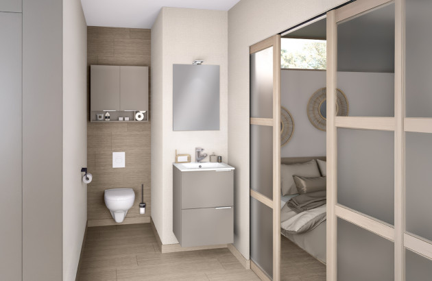 Petite salle de bains optimisée avec meuble compact, WC suspendu et porte coulissante.