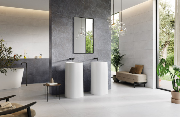 Salle de bains élégante avec double vasque sur pied et faïence murale gris anthracite.