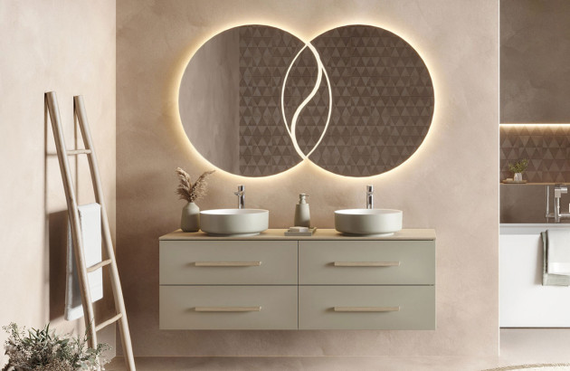 Double miroir rond lumineux sur le mur au dessus d'un meuble de salle de bains