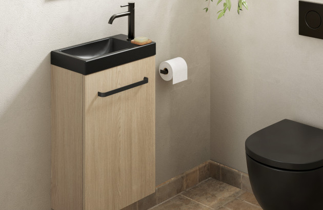 Petit meuble WC avec vasque dans des toilettes