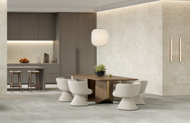 Carrelage de cuisine beige effet pierre dans un espace repas moderne et lumineux