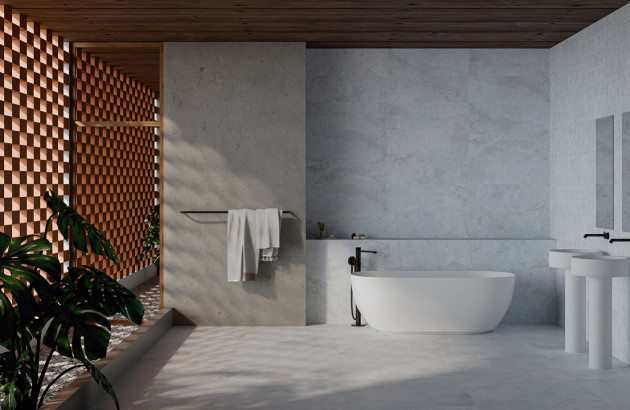 Salle de bains élégante avec meuble texturé, baignoire îlot et carrelage aux tons naturels.