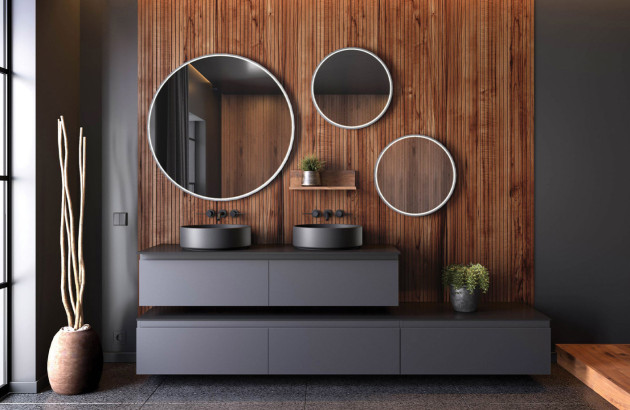 salle de bains avec meuble suspendu noir, 3 miroirs ronds design, des vasques noires à poser et de la robinetterie noire très tendance