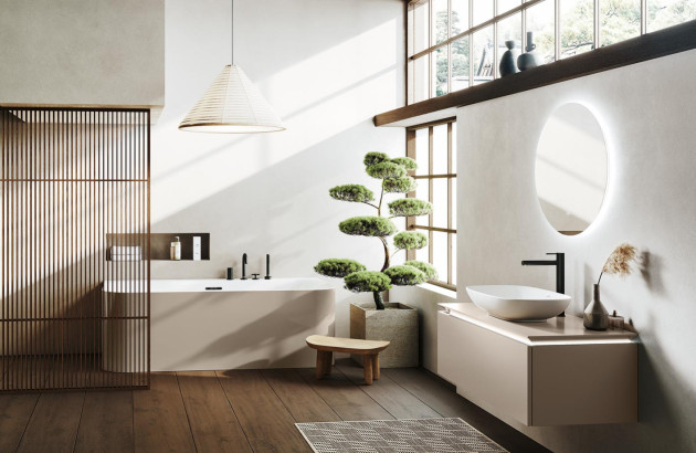 salle de bain luxueuse de style japonais ou Wabi-Sabi avec une baignoire encastrée et un grand bonsaï avec un meuble-lavabo suspendu et un miroir ovale rétroéclairé