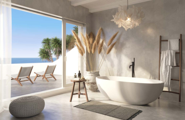 salle de bains blanche avec ouverture sur la mer