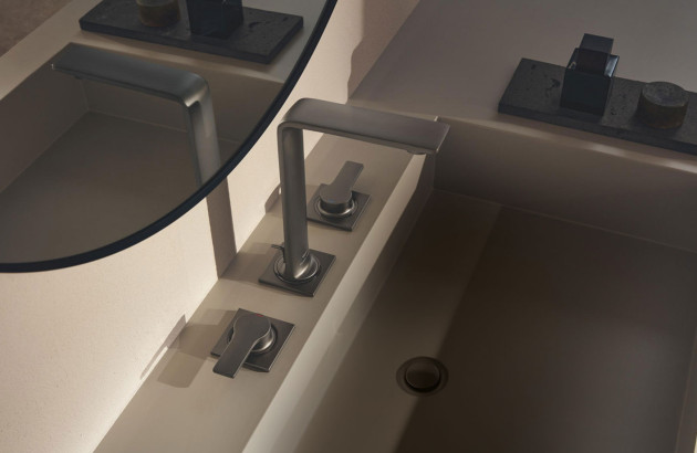 Mitigeur trois trous noir mat au design contemporain intégré à une vasque moderne minimaliste.