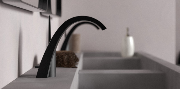 Mitigeur noir mat design installé sur un plan vasque moderne avec double lavabo aux lignes épurées.