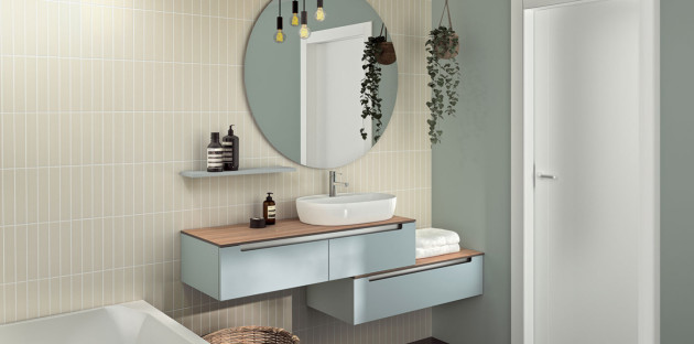 Vasque et meuble sous vasque dans une salle de bain couleurs pastels